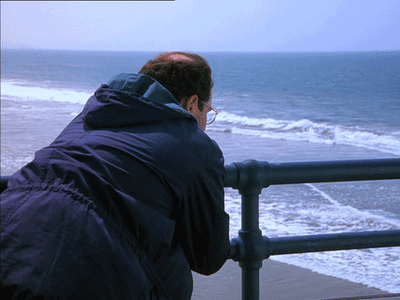 George Costanza looking out over the ocean.
