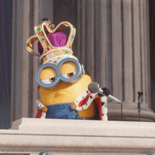 A minion wearing crown and cape dropping a microphone.