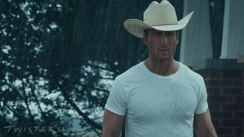 Character in Twisters movie walking in the rain