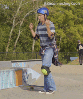 Man from Reconnecting Roots dancing with safety gear on