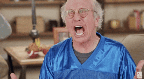 Gif of Larry David in a blue jersey saying "fumble!"