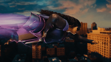 Lizzo dressed as a superhero flying through the city.