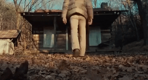 Gif of someone walking towards a spooky cabin.